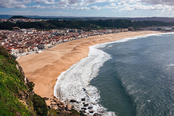 View Nazare. Coastline of Atlantic ocean. Portuguese seaside town.