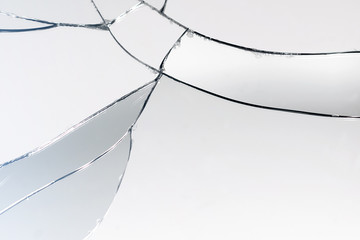 Crack and broken mirror in a front view image.