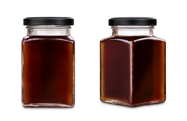Square jar of honey with black cap