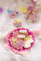 Fototapeta na wymiar Birthday cookies - detail of a dessert table - colorful cookies with pink 'Happy Birthday' topper