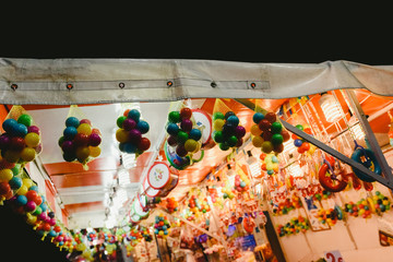Naklejka premium Valencia, Spain - January 19, 2019: Street candy stores at a fair.