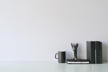 Mockup workspace desk and copy space books, coffee and pencil on white desk.