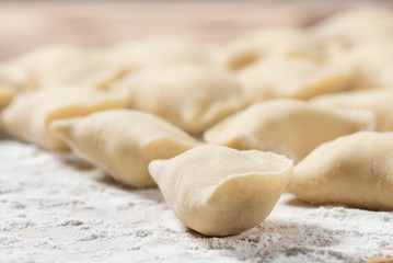 Raw dumplings ready to boil, close up. Also known as Vareniks, Ukrainian traditional cuisine