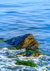 Waves and stones on the beach in Istanbul