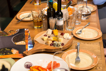 served table, cheese plate, food, dishes, glasses,