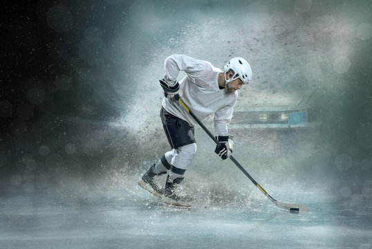 Caucasian ice hockey Players in dynamic action in a professional