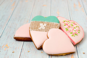 Pink gingerbread heart-shaped. Shabby chic style. On a light village background.