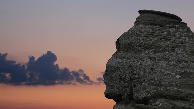 The Sphinx Rock (Sfinxul) in Bucegi Mountains Romania at sunset