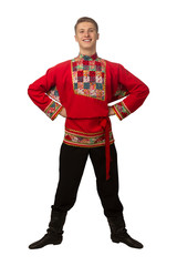 Attractive russian guy dancing in folk costume isolated on white