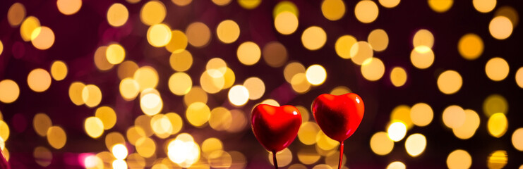 Banner with bokeh and two hearts. Valentine's day concept