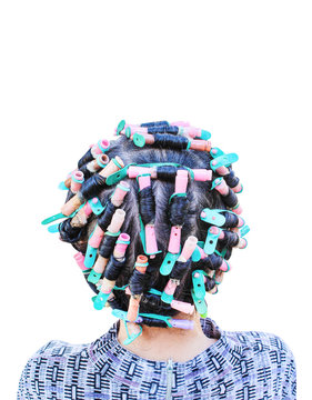 Back head of asian woman curling  and colorful rollers with hair perm solution isolated on white background