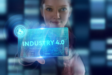 The concept of business, technology, the Internet and the network. A young entrepreneur working on a virtual screen of the future and sees the inscription: Industry 4.0