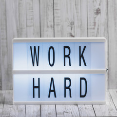 Obraz premium Lightbox with Powerful, Inspirational and Motivational Two Word Quote, Work Hard