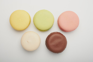 delicious dessert pastries French macaroons on white background
