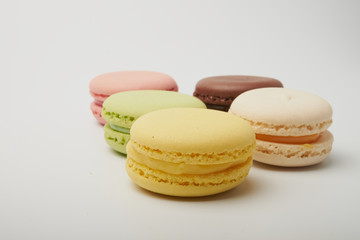 delicious dessert pastries French macaroons on white background