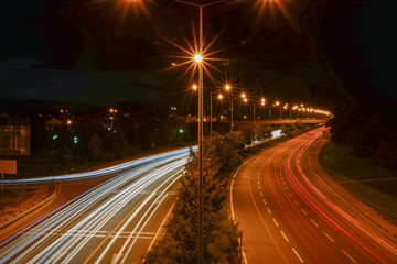 Fototapeta na wymiar Rushhour traffic long exposure on the bridge lightpainting