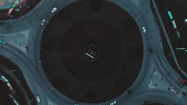 Aerial view to the road circle with city cars traffic 4k cinematic color, top view, Ternopil, Ukraine