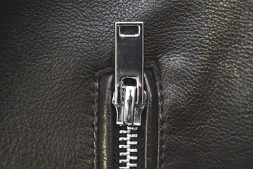 Zipper, lightning on black leather