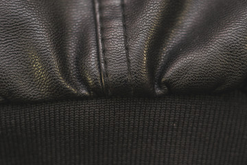 Stitches in black leather