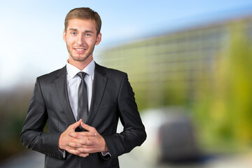Young handsome businessman smiling