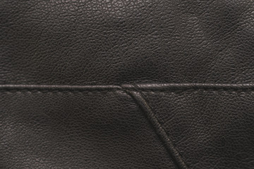 Stitches in black leather