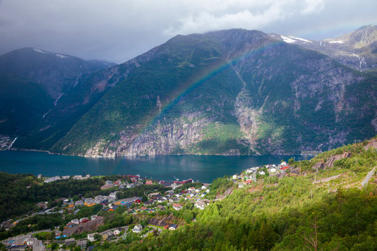 Rainbow over the Tyssedal town at Sorfjorden fjord Hordaland Norway Scandinavia