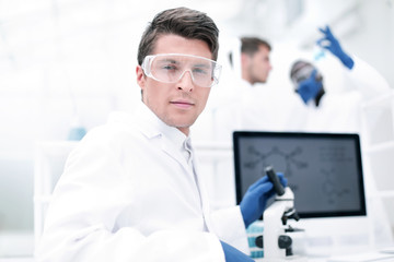 close up. scientist microbiologist at the laboratory table