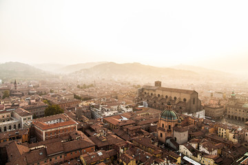 Aerial panoramic cityscape of Bologna, Italy, above rooftops of typical houses, ancient buildings and medieval towers  © melnyksergey