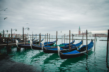 Fototapeta na wymiar Venice with famous gondolas at sunrise, Italy