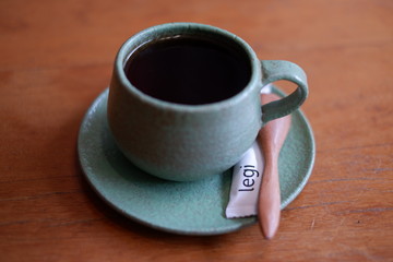 cup of coffee on wooden table
