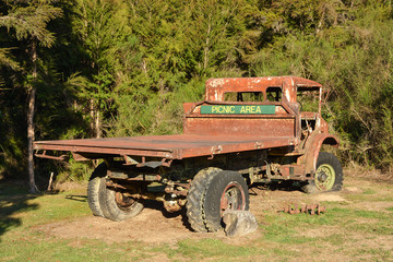 Old abandoned rusty truck, ideal place to take quick picnic