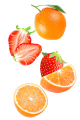 Falling strawberry and orange isolated on white