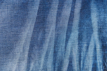 Blue jeans with pleats textured background
