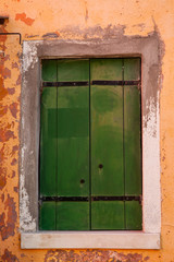 Old building in Venice, Italy. Vintage window with rusty decorative bars