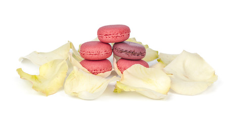 Delicious four pink macarons or macaroons isolated on a white background