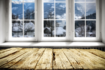 Table background and window of winter landscape 