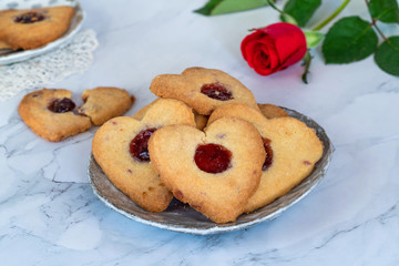 Naklejka na ściany i meble Shortbread hearts with cherry jam. Valentine food idea.