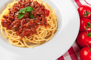 Pasta with meat, tomato sauce and vegetables on the table
