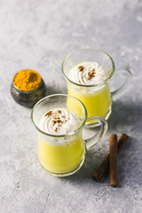 Turmeric golden milk latte. Selective focus, space for text.