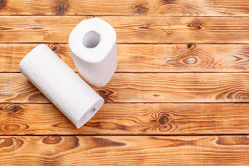 Roll of paper towel on wooden background