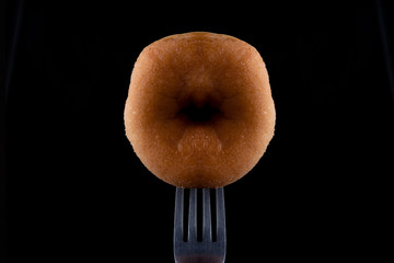 Pink a donut by fork