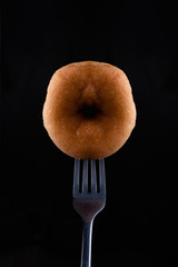 Pink a donut by fork