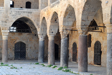 Fototapeta na wymiar Colonnade at Khan al Umdan, Caravanserai in Acre, Israel
