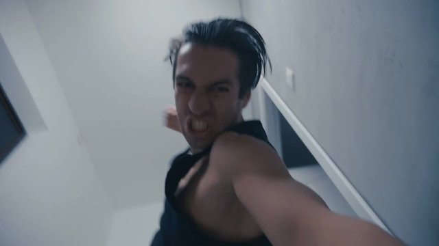 aggressive man brutally beats lying opponent