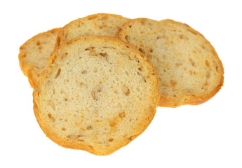 Side view of four pieces of sesame round melba toast isolated on a white background.