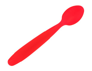 Red plastic baby food spoon isolated on a white background.