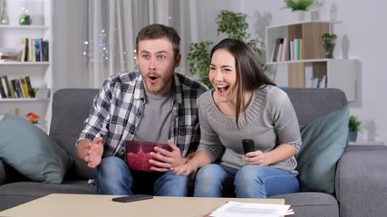 Frustrated friends suffering a blackout during tv sports match at home