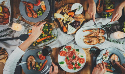 Top view image of family celebrating birthday, happy friends dinning together at home enjoying...