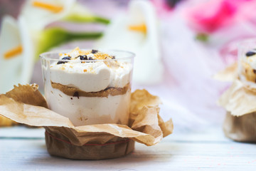 Tiramisu dessert in transparent plastic cup