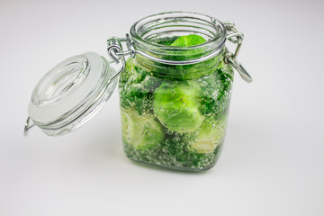 A variety of canned products in glass jars - tomatoes, cucumbers, Brussels sprouts, broccoli. Preservation of vegetables and fruits. canning. Preservation of the harvest. isolate
